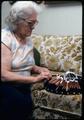Mildred Urie making bobbin lace and assorted pillows used to make lace