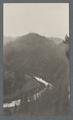 River flowing alongside mountains, possibly the coastal range, circa 1910