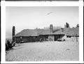 Front of Cloud Cap Inn, with group of people on porch of building.