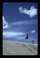 Man leaping on sand dune near Burns, Oregon, 1975