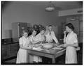 Women students evaluating cheese in Withycombe Hall, April 1952