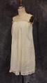 Chemise of ivory batiste cotton with pin tucks along top and lace trim above