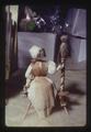 Corn husk doll in flower shop, Oregon, 1974