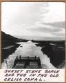 Sunset scene, barge and tug in the old Celilo Canal