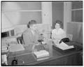 Robert Hirstel, personnel director at Lipman Wolfe Co., explains some of the duties to counselor-in-training Margaret Henderson, who during school year is counselor at Portland's Roosevelt High School, August 10, 1950