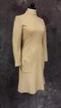 Dress of beige wool with round neckline with ring collar