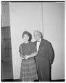 Earl W. Wells with Jan Marquiss holding her first place trophies from Western Speech Tournament, 1960