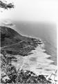 View of coast highway looking south from Cape Perpetua.  Photo dated sometime in the mid 1930's as the bridge across Cook's Chasm is shown.