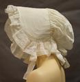 Sunbonnet of white cotton with quilted brim trimmed in ruffle pin-pleated into the brim