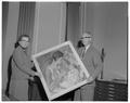 Dean Miriam Scholl and President Strand displaying a painting purchased by the OSC Foundation for the home management house, August 1957