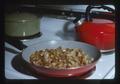 Fried potatoes in pan on stove, 1975