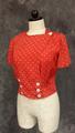 Blouse of bright red silk with white polka-dots