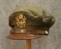 WWII US Army Air Force Cap of olive wool with brown leather strap and brown leather visor