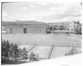 View of Weatherford Hall dorm complex and tennis courts looking north, June 1957