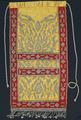 Apron of yellow and red sateen embroidered with raised metallic cord embroidery