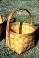 Same style as Easter baskets but larger. 1974. 9.25 x 8.5 x 6.25 inches, 10 inches tall with handle