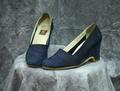 Wedge pumps of navy blue suede with abstract embroidered lion face on vamp
