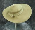 Picture hat of light tan (camel) of new wool felt with grosgrain ribbon band with bow in back and jeweled hatpin