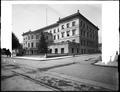 Portland City Hall from intersection of 4th and Madison. Streetcar tracks in foreground.