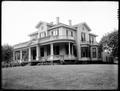 Unidentified wood house, Portland, with columns around front porch.