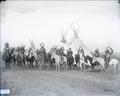 Group on horses in front of tepees
