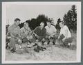 Five men burning rook lids, circa 1950