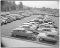 Cars parked outside of the Coliseum on student registration day