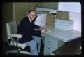 G. Burton Wood seated at a desk, Oregon State University, Corvallis, Oregon, 1975