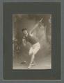 Unidentified OAC track and field athlete in a shot put pose, 1905