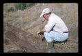 Murray Dawson looking at tire tracks, Corvallis, Oregon, circa 1971