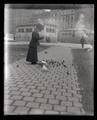 Irene Finley feeding pigeons