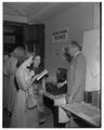 Dr. C.T. Yerian explains secretarial science display, 1951