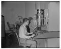 Dean Francois Gilfillan with new electron microscope installed by physics department, 1951