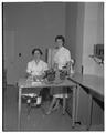 Marianne Strauss, (left) a Home Economics graduate student, with an unidentified individual, June 1954