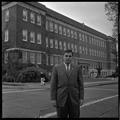 Gary Ford, a member of OSU's G.E. College Bowl team, posing outside of the Commerce Building