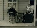 Mr. and Mrs. D. T. Powell on front porch in Harrisburg, Oregon, 1909