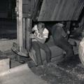 Two Workers Closing Burlap Hop Bale 7