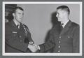 Two unidentified ROTC officers shaking hands, 1963