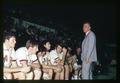 Coach Ralph Miller and basketball reserves on the bench, Oregon State University, Corvallis, Oregon, circa 1970