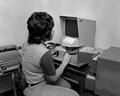 Student at microfilm reader