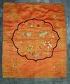 Table scarf of orange silk embroidered in satin stitch in multi-colored silks in sprigs of flowers, female phoenix, moon (white), sun (dark orange) amid cloud motifs