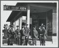 Military officers standing outside of the OAC Co-Op on 15th Street (site of the present day Kerr Administration Building)