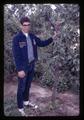 FFA student Louis Heaton standing by grafted pear, Oregon State University, Corvallis, Oregon, circa 1965