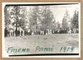 Picnic at Friend,1918 - Large group of people gathered under pine trees