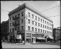 Shea Building at 2nd and Burnsides, Portland. Hotel Coast on upper floors. Employment Agency, other stores on ground floor. Army Recruiting flag over street.