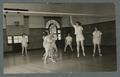 Women playing volleyball during gym class in Women's Building, 1940