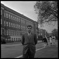 Gary Ford, a member of OSU's G.E. College Bowl team, posing outside of the Commerce Building