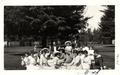 Women seated on lawn