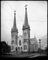 Front view of St. Francis Catholic Cathedral, corner of E. 12th and Pine, Portland. Power pole in foreground.