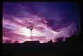 Windmill and sunset in Nebraska on Schudel Farm, circa 1965